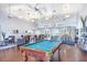Bright clubhouse featuring a pool table, lounge area, and ample seating for residents and guests at 113 Seahorse Se Dr # D, St Petersburg, FL 33705