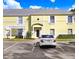 Exterior shot showcasing the home's architectural details, windows, and parking in front of the building at 113 Seahorse Se Dr # D, St Petersburg, FL 33705