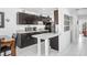 Modern kitchen with granite countertops, stainless steel appliances, and dark wood cabinetry at 113 Seahorse Se Dr # D, St Petersburg, FL 33705