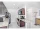 Stylish kitchen featuring granite counters, updated appliances, and modern lighting at 113 Seahorse Se Dr # D, St Petersburg, FL 33705