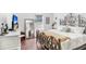 This main bedroom boasts an ornate bed frame, hardwood floors and natural light at 113 Seahorse Se Dr # D, St Petersburg, FL 33705