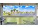Scenic view of the pond and lawn as seen from the balcony of this home at 113 Seahorse Se Dr # D, St Petersburg, FL 33705
