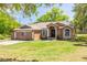 Charming single-story home with a well-maintained lawn and inviting front entrance at 11434 Minnieola Dr, New Port Richey, FL 34654