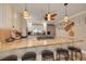 Bright kitchen featuring an island with seating, stainless steel appliances, and custom cabinetry at 11434 Minnieola Dr, New Port Richey, FL 34654