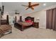 Spacious main bedroom with ceiling fans, private access to the backyard, and neutral carpeting at 11434 Minnieola Dr, New Port Richey, FL 34654