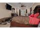 Cozy main bedroom featuring a king bed, side tables, and French doors that lead to the backyard at 11434 Minnieola Dr, New Port Richey, FL 34654
