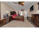 Large main bedroom with ceiling fans, private access to the backyard, and neutral carpeting at 11434 Minnieola Dr, New Port Richey, FL 34654