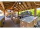 Extensive outdoor kitchen featuring multiple grills, a bar, and plenty of counter space for entertaining and cooking at 11434 Minnieola Dr, New Port Richey, FL 34654