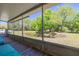 This home has a large screened in porch with views of the yard and pond beyond at 11434 Minnieola Dr, New Port Richey, FL 34654