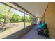 Enjoy the views of the spacious backyard and pond from this relaxing screened in porch with outdoor furniture at 11434 Minnieola Dr, New Port Richey, FL 34654