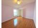 Bedroom featuring hardwood floors, ceiling fan, and a closet with open doors at 1227 Big Creek Dr, Wesley Chapel, FL 33544