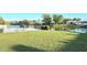 Green backyard with water view and community amenities at 1301 S Hercules Ave # 3, Clearwater, FL 33764