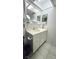 Bathroom featuring a vanity, sink, mirror, cabinet and tile floor at 1301 S Hercules Ave # 3, Clearwater, FL 33764