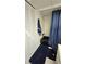 Bathroom featuring a bathtub, shower, toilet and vanity with a blue color scheme at 1301 S Hercules Ave # 3, Clearwater, FL 33764