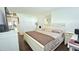 Cozy bedroom showcasing a well-made bed with closet and white furniture, offering comfort and style at 1301 S Hercules Ave # 3, Clearwater, FL 33764