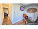 Bedroom featuring a chair, TV, sports decor and wood floors at 1301 S Hercules Ave # 3, Clearwater, FL 33764
