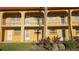 Exterior view of the property with yellow facade and well-maintained landscaping at 1301 S Hercules Ave # 3, Clearwater, FL 33764