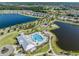 Beautiful aerial view of community pool and lakes at 13549 Willow Bluestar Loop, Riverview, FL 33579