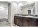 Bathroom featuring a double sink and tile floors at 13549 Willow Bluestar Loop, Riverview, FL 33579