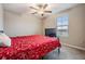 Bright bedroom with a ceiling fan and a window at 13549 Willow Bluestar Loop, Riverview, FL 33579