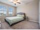 Comfortable carpeted bedroom with large windows at 13549 Willow Bluestar Loop, Riverview, FL 33579