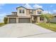 Charming two-story home with three-car garage and traditional design elements at 13549 Willow Bluestar Loop, Riverview, FL 33579
