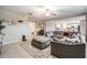 Comfortable living room with a large sectional sofa and view of the kitchen at 13549 Willow Bluestar Loop, Riverview, FL 33579