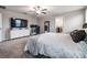 Bright main bedroom with a large dresser, desk, and natural light from the windows at 13549 Willow Bluestar Loop, Riverview, FL 33579