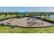 Community playground features swings, climbing dome, and slide at 13549 Willow Bluestar Loop, Riverview, FL 33579