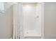 Clean shower with white tile surround and shower curtain at 13549 Willow Bluestar Loop, Riverview, FL 33579