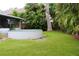 Green backyard featuring a pool and ample space for outdoor activities at 1519 Delaware Ne Ave, St Petersburg, FL 33703