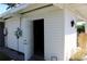 Exterior view of a white home with an open garage, showing the house number at 1519 Delaware Ne Ave, St Petersburg, FL 33703