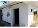 Exterior view shows the side of this home with a utility door and access to the backyard at 1519 Delaware Ne Ave, St Petersburg, FL 33703