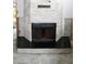 Modern, stone-covered fireplace and hearth waiting for trim and flooring at 1519 Delaware Ne Ave, St Petersburg, FL 33703