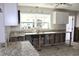 Kitchen features granite countertops, stainless sink under large window, and ample cabinet space at 1519 Delaware Ne Ave, St Petersburg, FL 33703