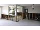 Open living space showcasing seamless flow into kitchen area with modern pendant lighting at 1519 Delaware Ne Ave, St Petersburg, FL 33703