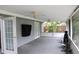 This covered patio offers fans and access to the backyard, perfect for entertaining or relaxing outdoors at 1519 Delaware Ne Ave, St Petersburg, FL 33703