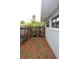 A view of the side yard and wooden fence, which creates a private space for gardening or storage at 1519 Delaware Ne Ave, St Petersburg, FL 33703