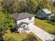 An overhead angle shows the house, its driveway, and its position on the lot at 16417 Lake Byrd Dr, Tampa, FL 33618