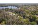 Aerial view of a lakeside community featuring tree-lined streets and beautiful single-Gathering homes at 16417 Lake Byrd Dr, Tampa, FL 33618
