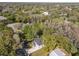 An aerial view showing the house from above, and a body of water in the distance at 16417 Lake Byrd Dr, Tampa, FL 33618