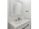 Modern bathroom featuring a single vanity and framed mirror at 16417 Lake Byrd Dr, Tampa, FL 33618