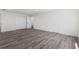 Spacious bedroom features wood flooring, closet and views into the ensuite bathroom at 16417 Lake Byrd Dr, Tampa, FL 33618