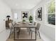 Bright dining room features modern decor, a large table with seating for six, and natural light at 16417 Lake Byrd Dr, Tampa, FL 33618