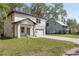 Two-story home with a two-car garage and a landscaped yard at 16417 Lake Byrd Dr, Tampa, FL 33618