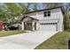 Two-story home with a two-car garage and well-manicured lawn at 16417 Lake Byrd Dr, Tampa, FL 33618