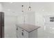 Bright kitchen featuring a granite island, stainless steel appliances, and pendant lighting at 16417 Lake Byrd Dr, Tampa, FL 33618