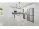 Bright kitchen featuring stainless steel appliances, granite counters, and a large island at 16417 Lake Byrd Dr, Tampa, FL 33618