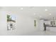 Bright living room featuring recessed lighting and large windows allowing for ample natural light at 16417 Lake Byrd Dr, Tampa, FL 33618