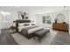 Serene main bedroom with a large bed, contemporary furnishings, and ample natural light at 16417 Lake Byrd Dr, Tampa, FL 33618